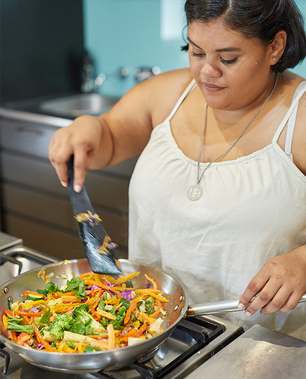 woman on GLP-1s making healthy food